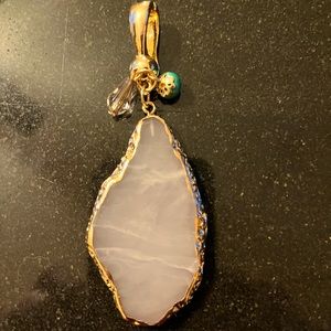 Wearable art by Roman white stone with gold trim